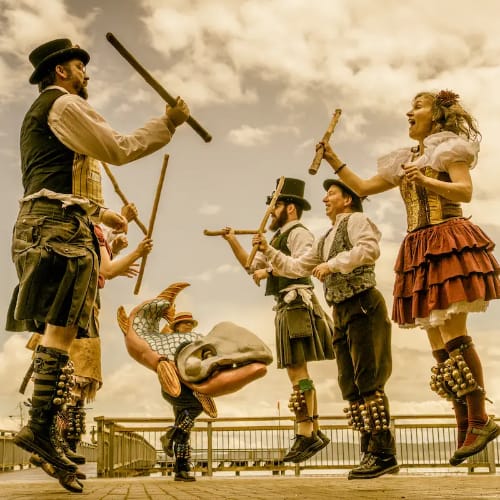 Sound and Fury Morris dancers clacking sticks together